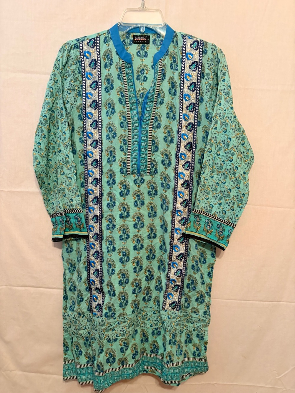 Turquoise tunic with a vibrant paisley floral print with dark blue white border